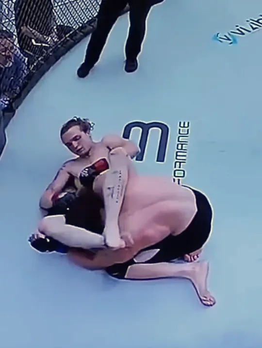Overhead broadcast view of Nathan Johnson on the mat at his LFS debut